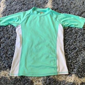 Teal and White O’rageous Rashgaurd
